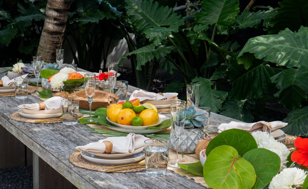 Lauren tries to make every family meal special and doesn’t hold back on the decor. Here, the teak table in the backyard is set for lunch with greenery and flowers she pulled from their property.