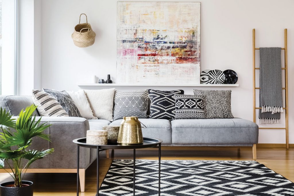 African décor mixed with modern art gives this living room personality