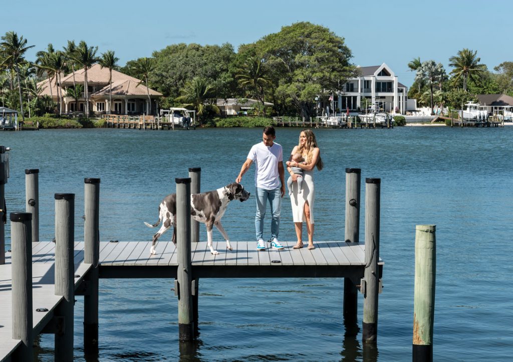 Camilo coaxes Pixie to join the family on the dock, something he says she rarely agrees to! Photography by Benjamin Rusnak