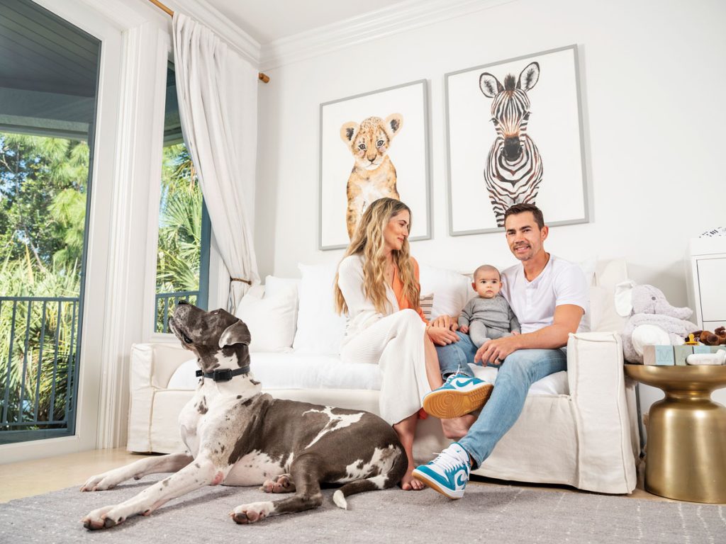 Maria, Camilo, Mateo, and the family’s Great Dane, Pixie, hang out in Mateo’s nursery. Photography by Benjamin Rusnak