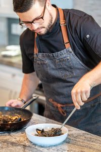 Kyle Ripple sautées some mussels. Photo courtesy of Ripples in Motion
