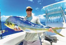 May is for Reeling in Dolphinfish Jupiter resident Will Claunch showing off a bull dolphin caught last May. Photo by George LaBonte