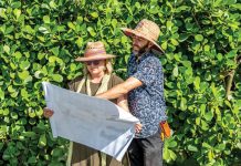 Leslie Bosson Creates Nourishing Home Gardens Leslie Bosson and her husband, lead horticulturist Enrique Gutierrez, review plans for a new landscape design. Photo by Marcos Schonholz