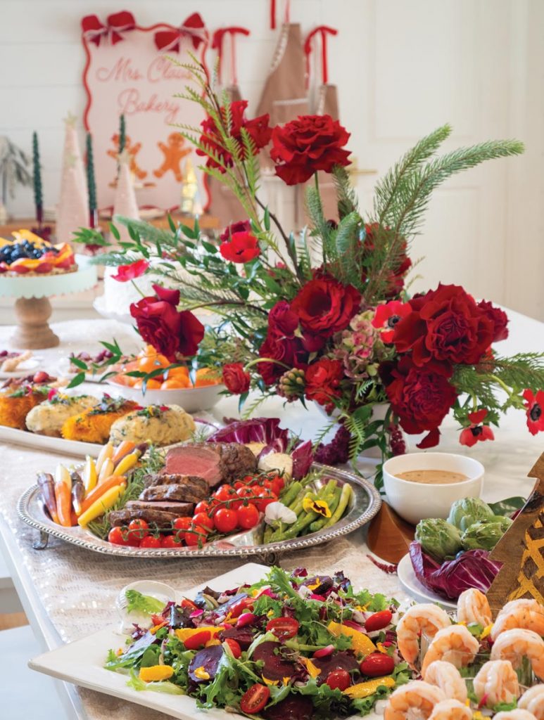 Chef Maude Eaton prepared the family’s Christmas Eve meal—served buffet-style amidst floral arrangements in rich reds by Rachel Vanatta. Photo by Jerry Rabinowitz