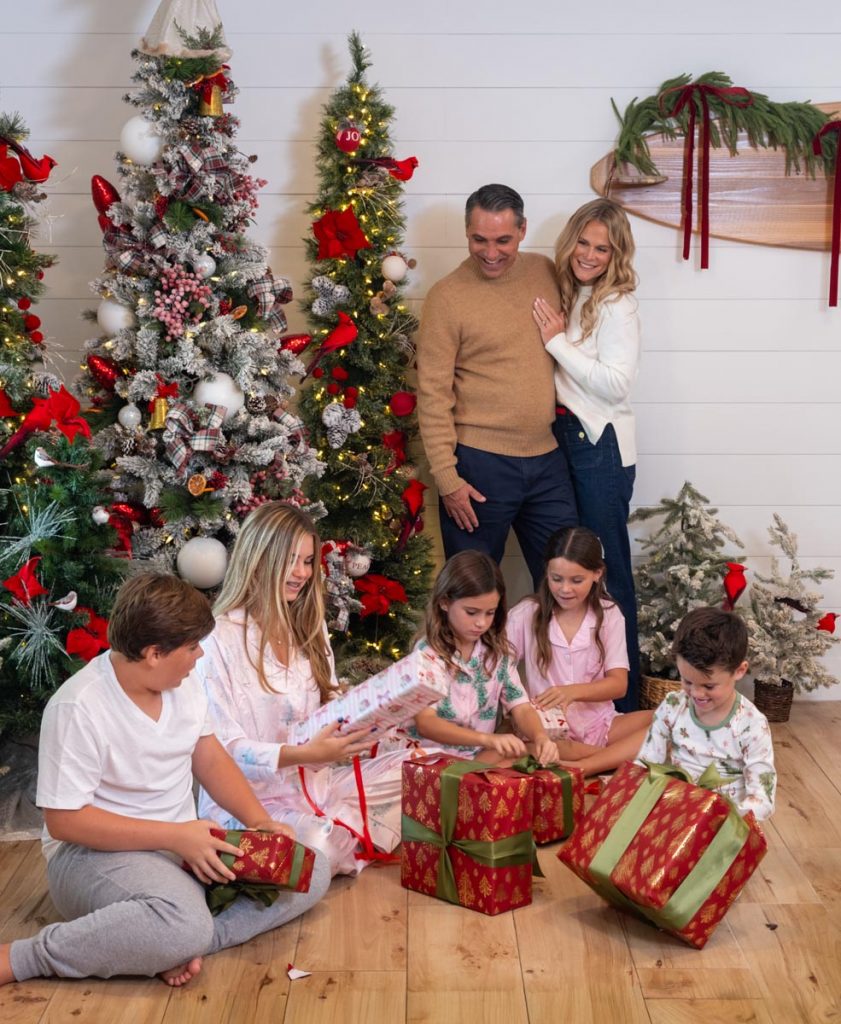 Jay and Anna watch as Banyan, Beach, Breezy, Baylily, and Brave tear into their Christmas gifts. Photo by Jerry Rabinowitz